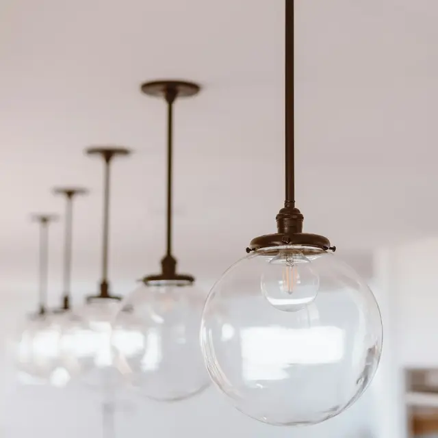 A row of glass globe pendant lights